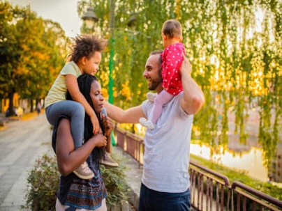 Adoptive parents holding children